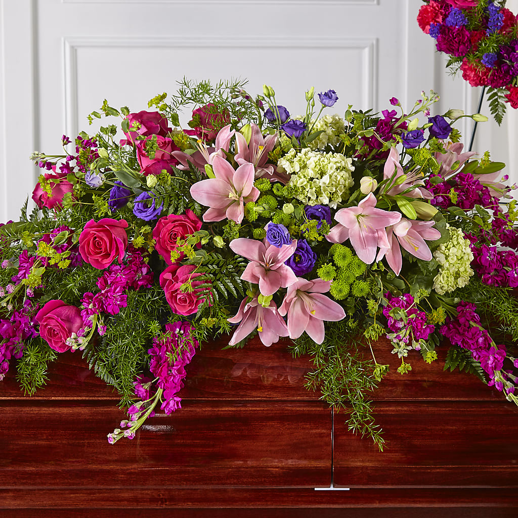 Radiant Tribute Casket Spray – The Flower Nook Inc, Orlando FL